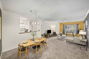 Raleigh apartment for rent - A dining room with a wooden table and chairs.