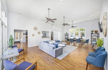 Raleigh apartment for rent - the living room and dining room of a house with blue chairs and couches