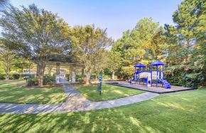 Raleigh apartment for rent - a park with a playground and trees
