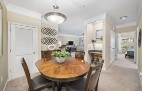 Raleigh apartment for rent - a dining room with a wooden table and chairs