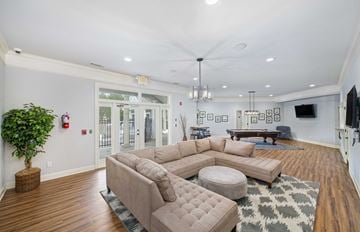 Raleigh apartment for rent - a living room with a couch and a table