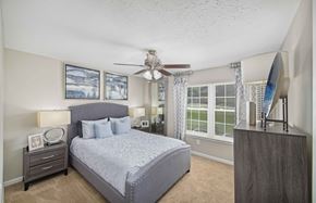 Nashville apartment for rent - a bedroom with a bed and a ceiling fan