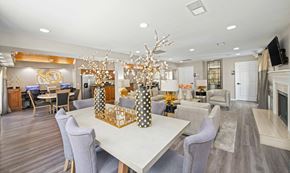 Nashville apartment for rent - a dining room with a white table and chairs and a fireplace