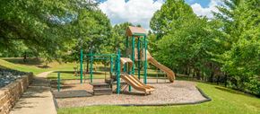 Hendersonville apartment for rent - a playground with a slide in a park