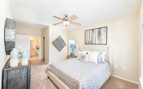 Gallatin apartment for rent - a bedroom with a bed and a ceiling fan