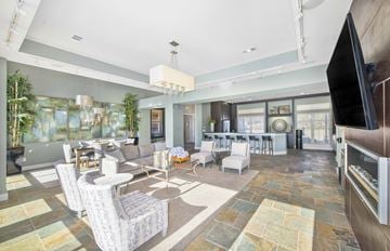 Hendersonville apartment for rent - a living room with couches and chairs and a television