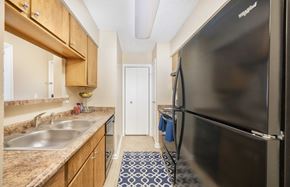 Lexington apartment for rent - a kitchen with a stainless steel refrigerator and a sink