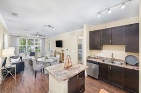 Franklin apartment for rent - A kitchen with dark wood cabinets and a granite counter top.