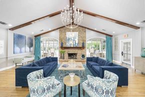 Murfreesboro apartment for rent - A living room with a fireplace and a chandelier.