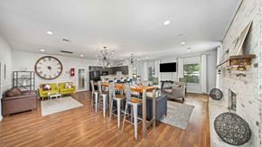 Chattanooga apartment for rent - a living room with a table and chairs and a fireplace
