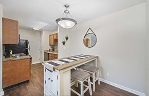 Chattanooga apartment for rent - a kitchen with a bar with three stools