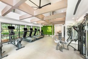 Huntsville apartment for rent - A gym with treadmills, weights, and exercise equipment.