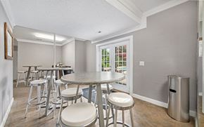 Hixson apartment for rent - a dining room with stools and a table with chairs