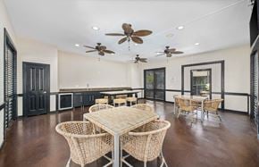 Hoover apartment for rent - a dining room with tables and chairs and ceiling fans