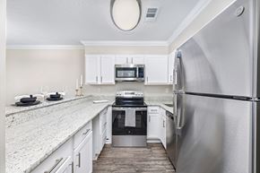 Memphis apartment for rent - A kitchen with a refrigerator on the right side.
