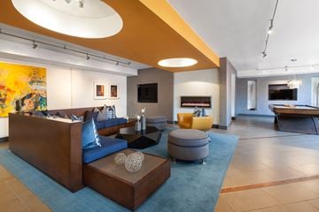 Kansas City apartment for rent - a living room with couches and chairs and a fireplace