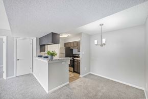 Memphis apartment for rent - a spacious living room with a kitchen with a counter top