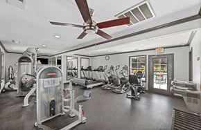 Memphis apartment for rent - a gym with cardio machines and a ceiling fan