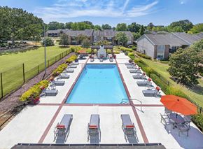 Memphis apartment for rent - an aerial view of a swimming pool with chairs and umbrellas