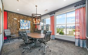Nashville apartment for rent - a conference room with a table and chairs and a window
