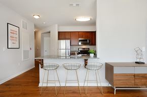 Allentown apartment for rent - a kitchen with a counter top and three bar stools