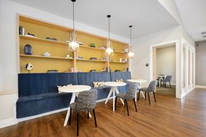 Allentown apartment for rent - a dining room with tables and chairs and a blue couch