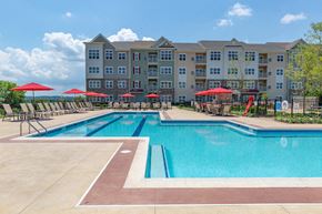 Allentown apartment for rent - a swimming pool with an apartment building in the background