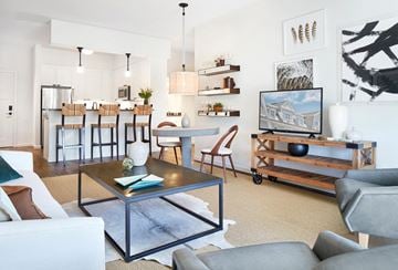 Amityville apartment for rent - a living room with a couch and a coffee table    and a kitchen