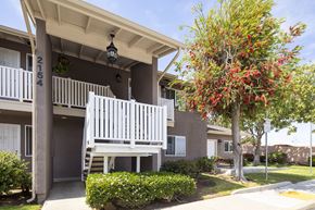 San Diego apartment for rent - a white porch swing in front of an apartment building