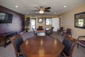 Santee apartment for rent - a dining room with a table and chairs and a ceiling fan