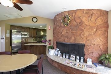 Santee apartment for rent - a living room with a fireplace and a table with chairs