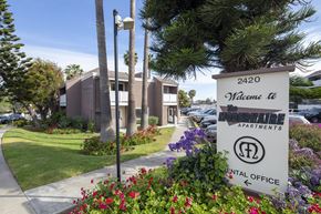 San Diego apartment for rent - Modernaire Community Clubhouse building , with path, Modernaire Apartments sign, and landscaping