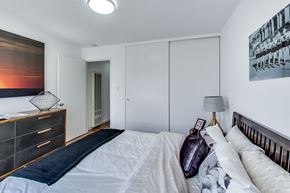 San Francisco apartment for rent - a bedroom with a large bed and a dresser