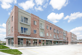 Lincoln apartment for rent - a large brick building with a sidewalk in front of it