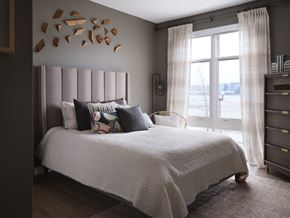 East Boston apartment for rent - a bedroom with a white bed and a pink headboard