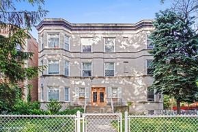 Chicago apartment for rent - a large house with a fence in front of it