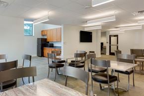 Wilmington apartment for rent - A modern dining room with a long table and chairs.