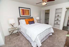 Houston apartment for rent - View of bedroom showing built-in shelving and walk-in closet.