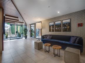 Los Angeles apartment for rent - the lobby of the building has a blue couch and tables