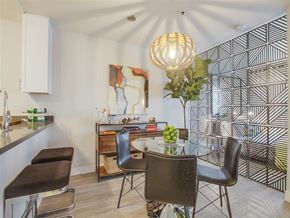 Los Angeles apartment for rent - a dining room with a table and chairs and a kitchen