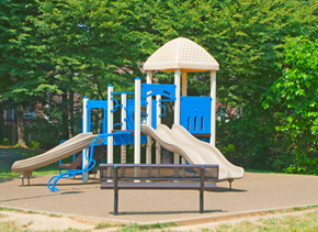 Columbia apartment for rent - a playground with slides and a bench in a park