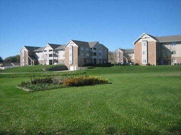 Indianola apartment for rent - a large green field with some apartments in the background