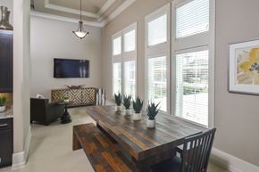 Arcola apartment for rent - A modern dining room with a wooden table and chairs.