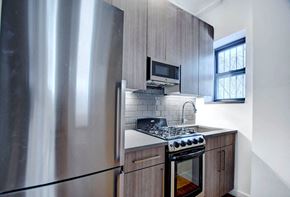 New York apartment for rent - a kitchen with a stove and a refrigerator