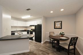 Lawrenceville apartment for rent - a kitchen and dining area with a table and chairs