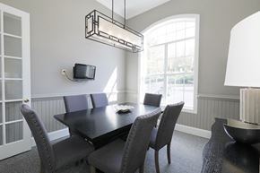 Norcross apartment for rent - a dining room with a table and chairs and a tv