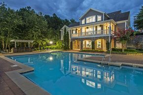Norcross apartment for rent - a large pool in front of a house at night