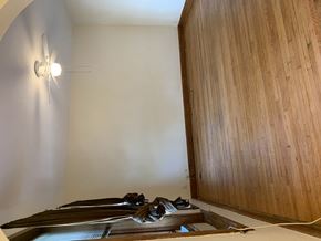 Chicago apartment for rent - an empty room with wooden floors and a ceiling fan