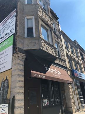 Chicago apartment for rent - a building with awning on the corner of a street