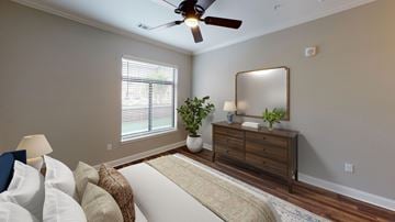 Germantown apartment for rent - A living room with a white couch and a wooden dresser.